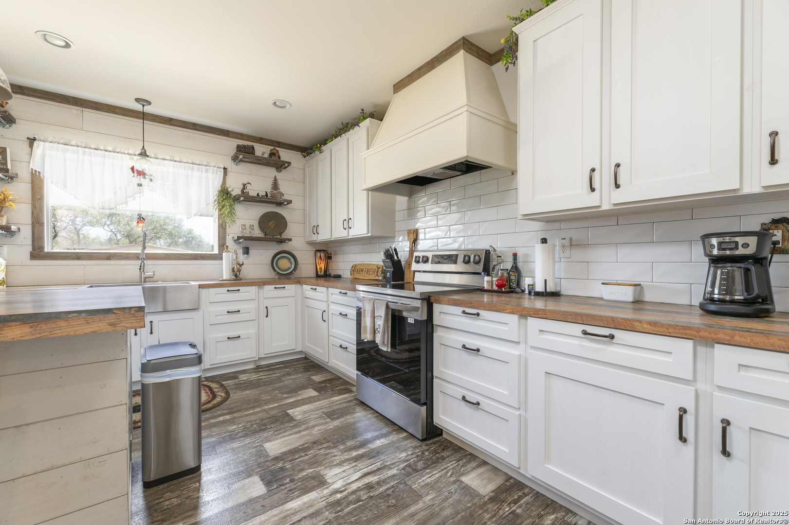 451 Pr 1505 Bandera, TX 78003 - Photo 12 of 43 a kitchen with white cabinets and white appliances