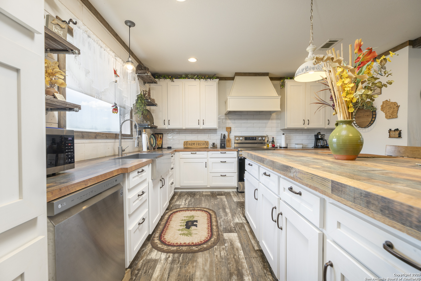 451 Pr 1505 Bandera, TX 78003 - Photo 16 of 43 a kitchen with stainless steel appliances granite countertop a sink and cabinets