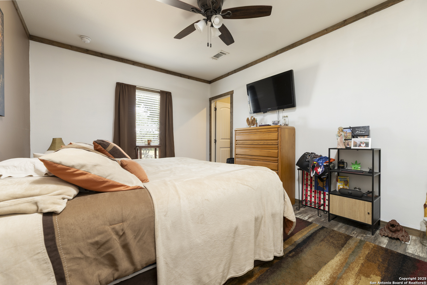 451 Pr 1505 Bandera, TX 78003 - Photo 33 of 43 a bedroom with a bed and flat screen tv