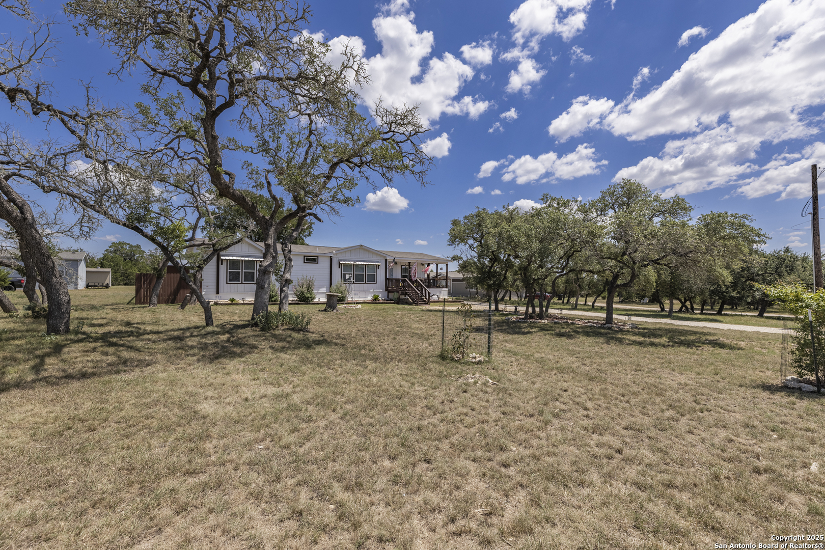 451 Pr 1505 Bandera, TX 78003 - Photo 5 of 43 a view of a yard with a tree