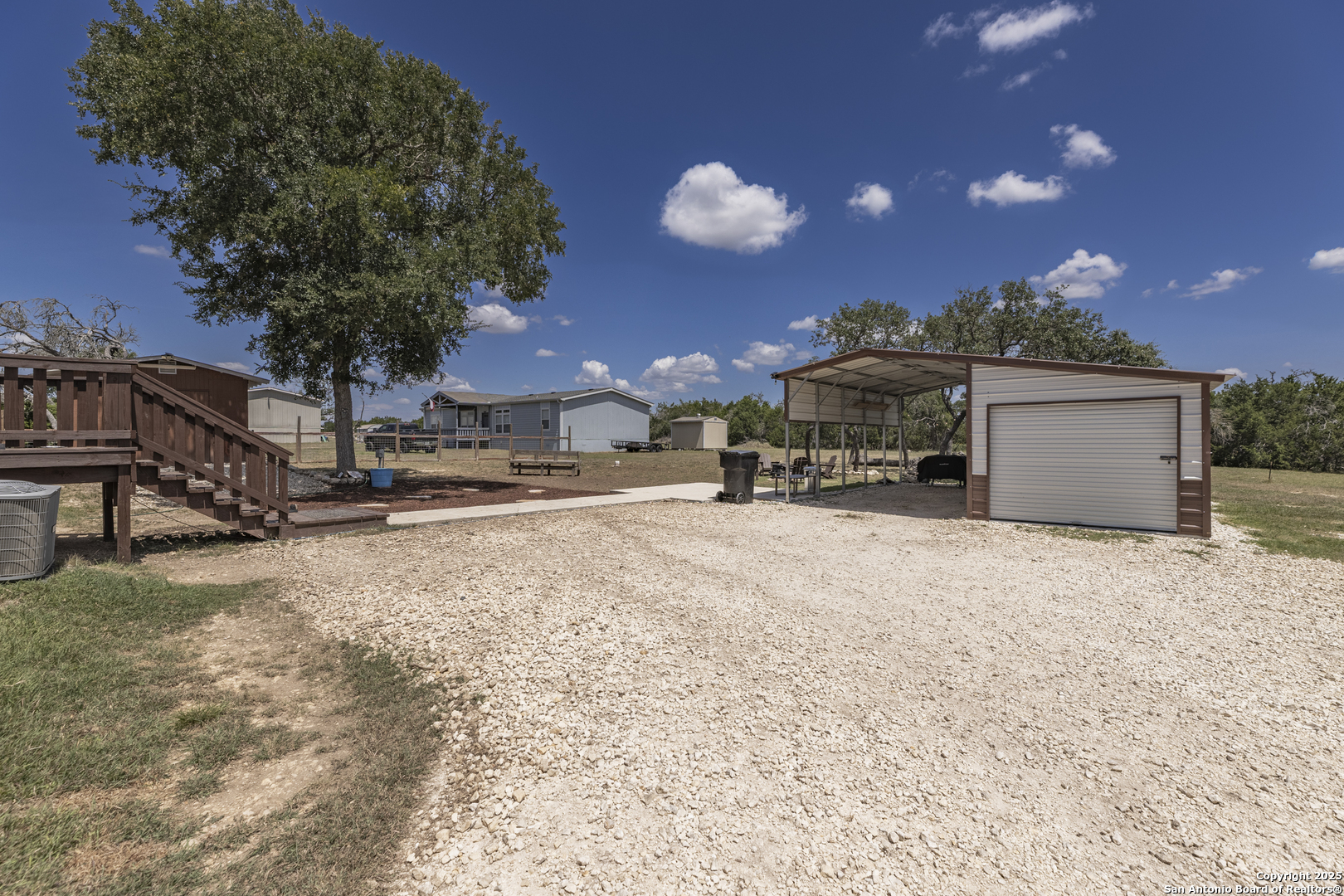 451 Pr 1505 Bandera, TX 78003 - Photo 6 of 43 a view of a house with a yard and garage