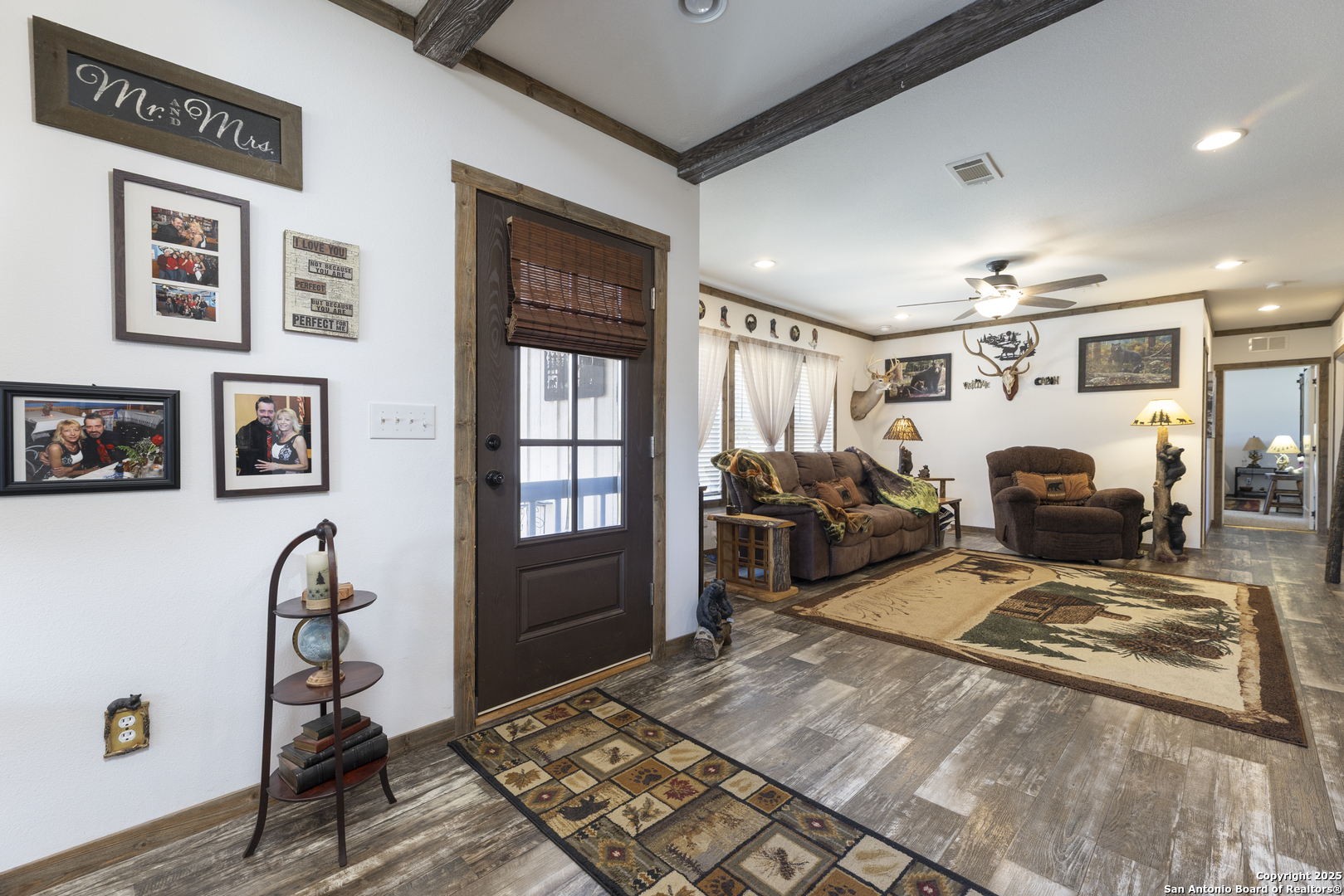 451 Pr 1505 Bandera, TX 78003 - Photo 7 of 43 a living room with furniture a rug and a fireplace