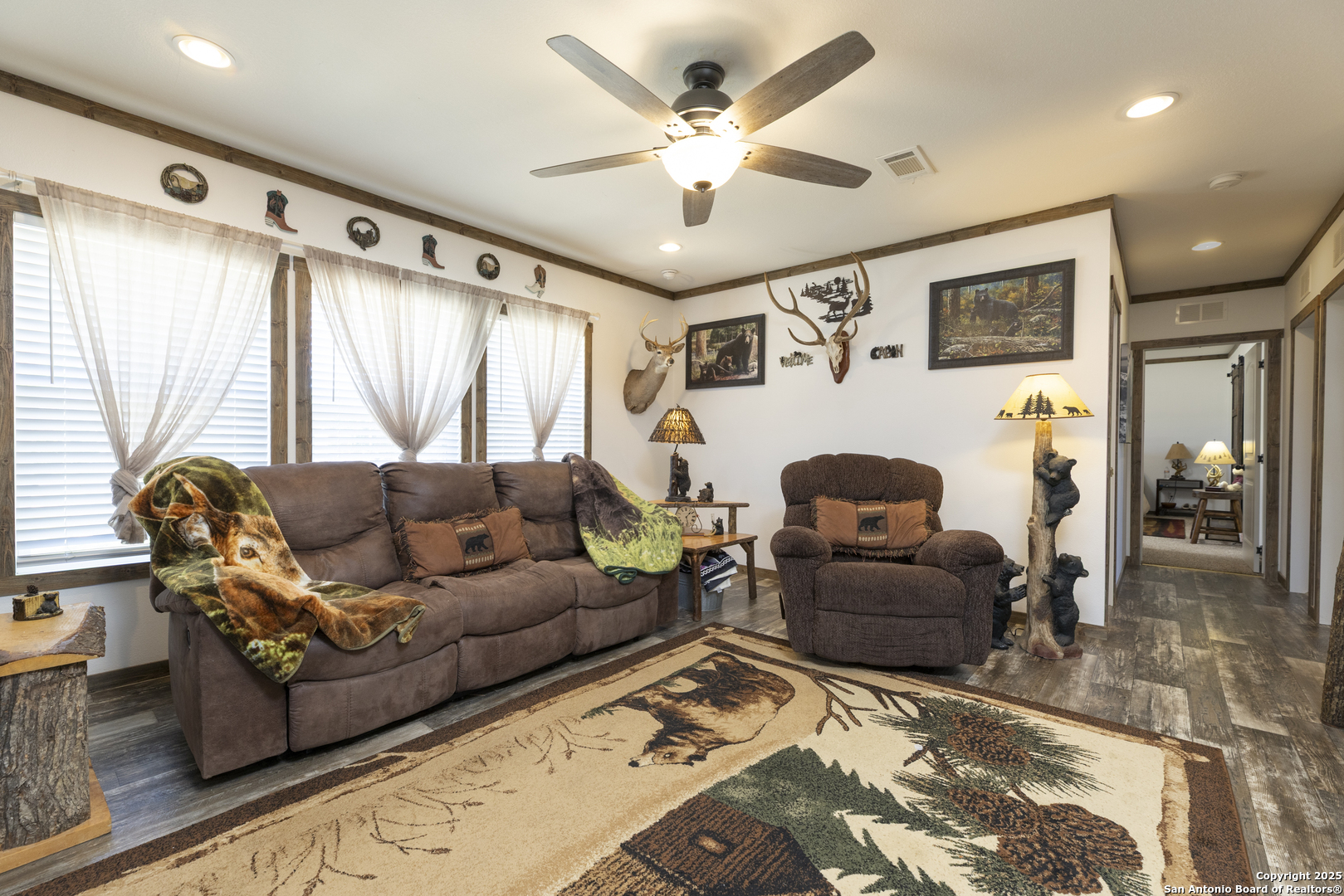 451 Pr 1505 Bandera, TX 78003 - Photo 10 of 43 a living room with furniture ceiling fan and a rug