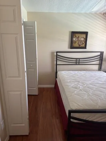 a room with a bed and cabinets