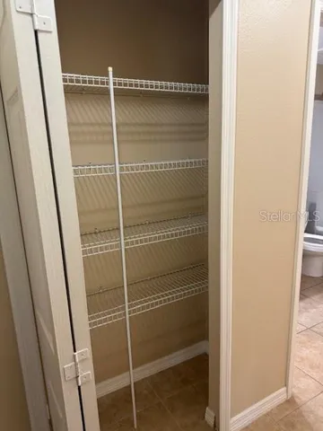 a bathroom with a glass door shower