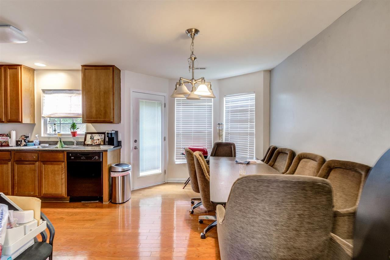 3713 Cyrus Street Raleigh, NC 27610 - Photo 13 of 30 Dining Area - open with the door to back yard Dining Area