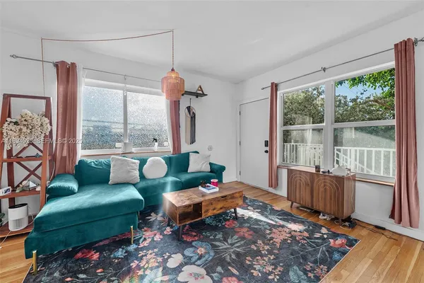 a living room with furniture and a large window