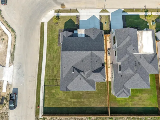 a view of living room with furniture and a lamp