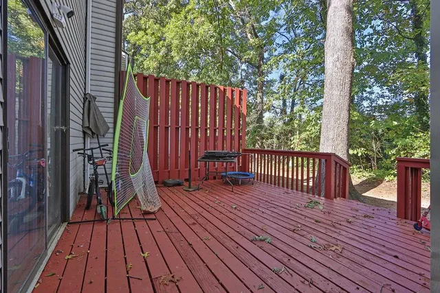 a view of outdoor space with wooden floor and fence