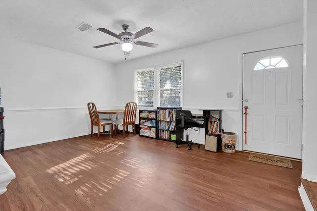 a living room with furniture and window