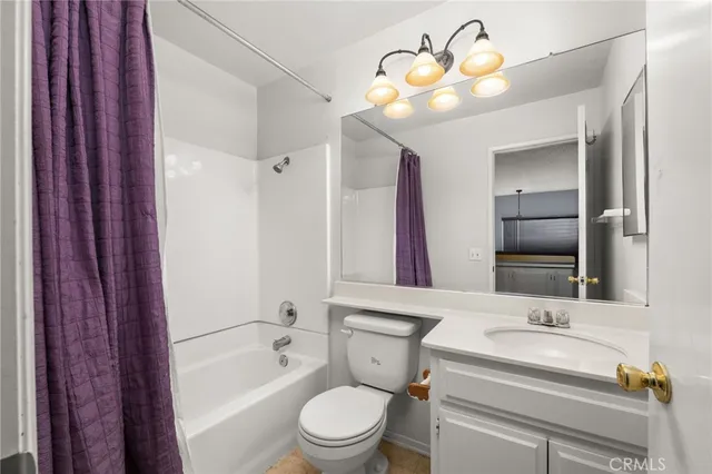 a bathroom with a sink a toilet and bathtub