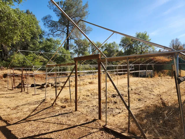 a view of a backyard with table and chairs