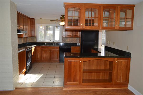 25 Wedgemere Road Beverly, MA 01915 - Photo 12 of 22 a kitchen with stainless steel appliances granite countertop a stove and a sink