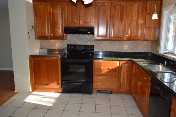 25 Wedgemere Road Beverly, MA 01915 - Photo 13 of 22 a kitchen with a cabinets and appliances