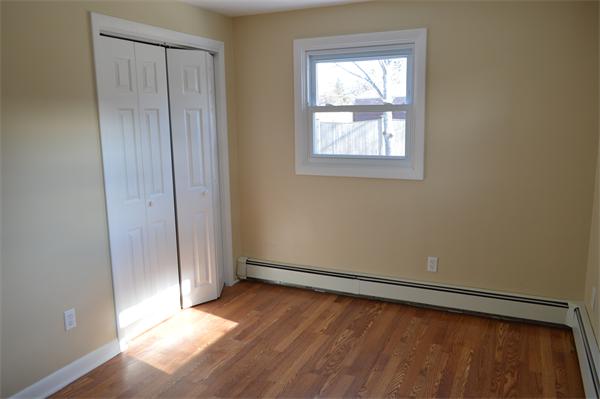 25 Wedgemere Road Beverly, MA 01915 - Photo 20 of 22 an empty room with windows