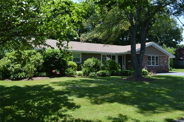 25 Wedgemere Road Beverly, MA 01915 - Photo 3 of 22 a front view of a house with a yard