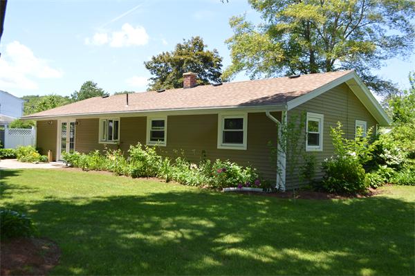 25 Wedgemere Road Beverly, MA 01915 - Photo 6 of 22 a front view of a house with a garden