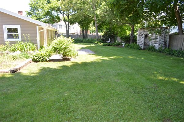 25 Wedgemere Road Beverly, MA 01915 - Photo 7 of 22 a view of a yard with plants and trees