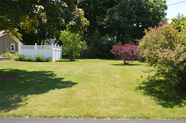 25 Wedgemere Road Beverly, MA 01915 - Photo 10 of 22 a backyard of a house with yard and garage