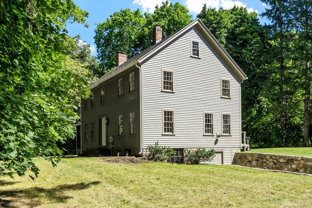 681 Barretts Mill Road Concord, MA 01742 - Photo 2 of 27 a front view of a house with a yard