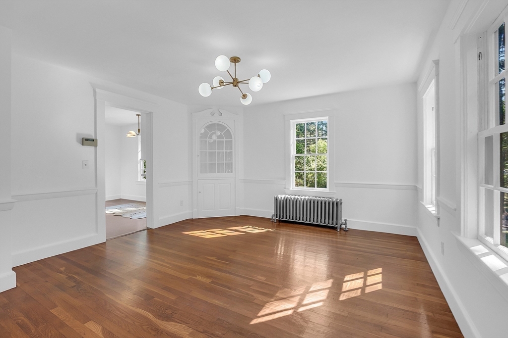 681 Barretts Mill Road Concord, MA 01742 - Photo 7 of 27 a view of an empty room with a window