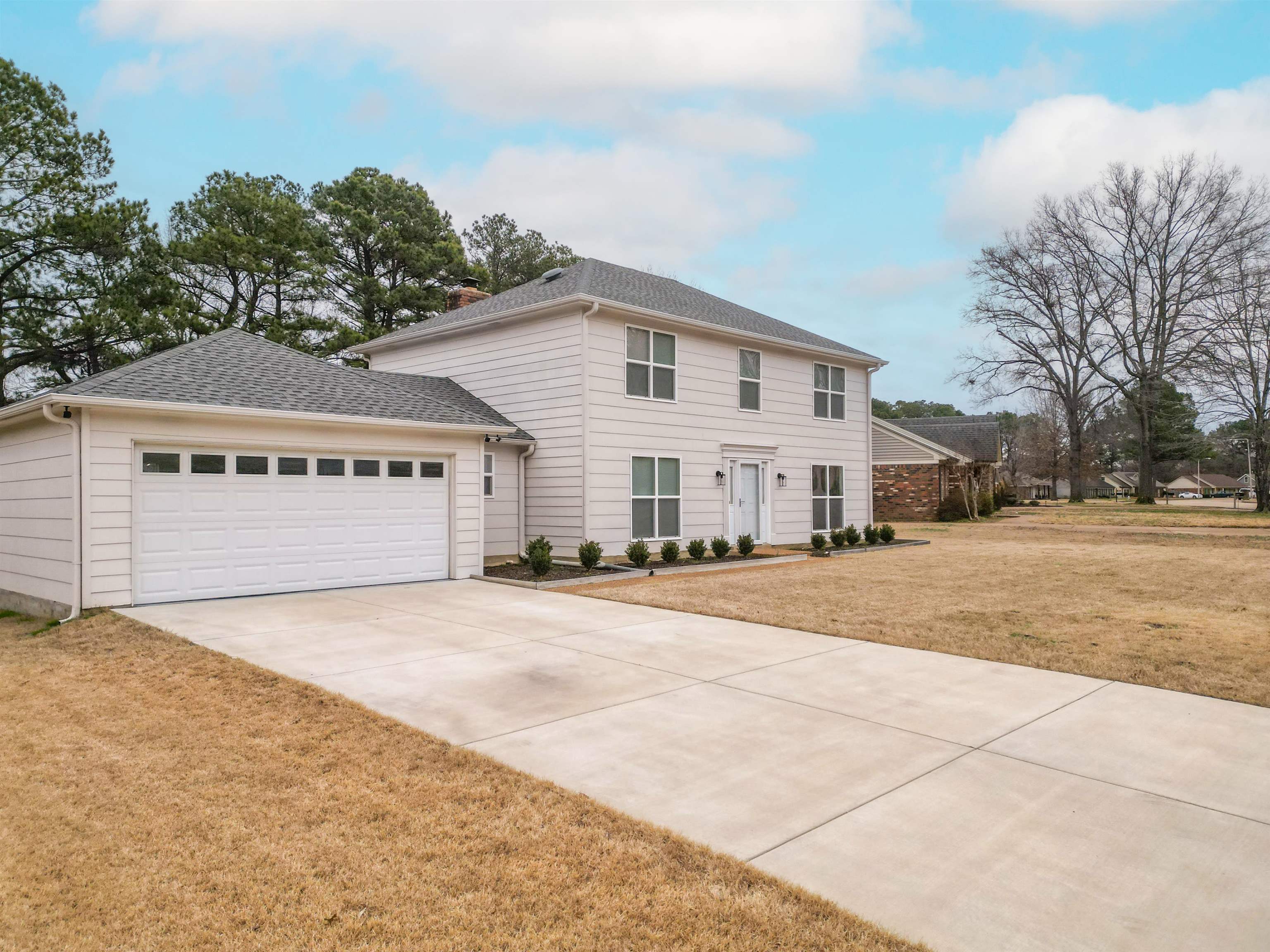 1642 Brierbrook Road Germantown, TN 38138 - Photo 1 of 37 View of front of home with a garage and a front yard