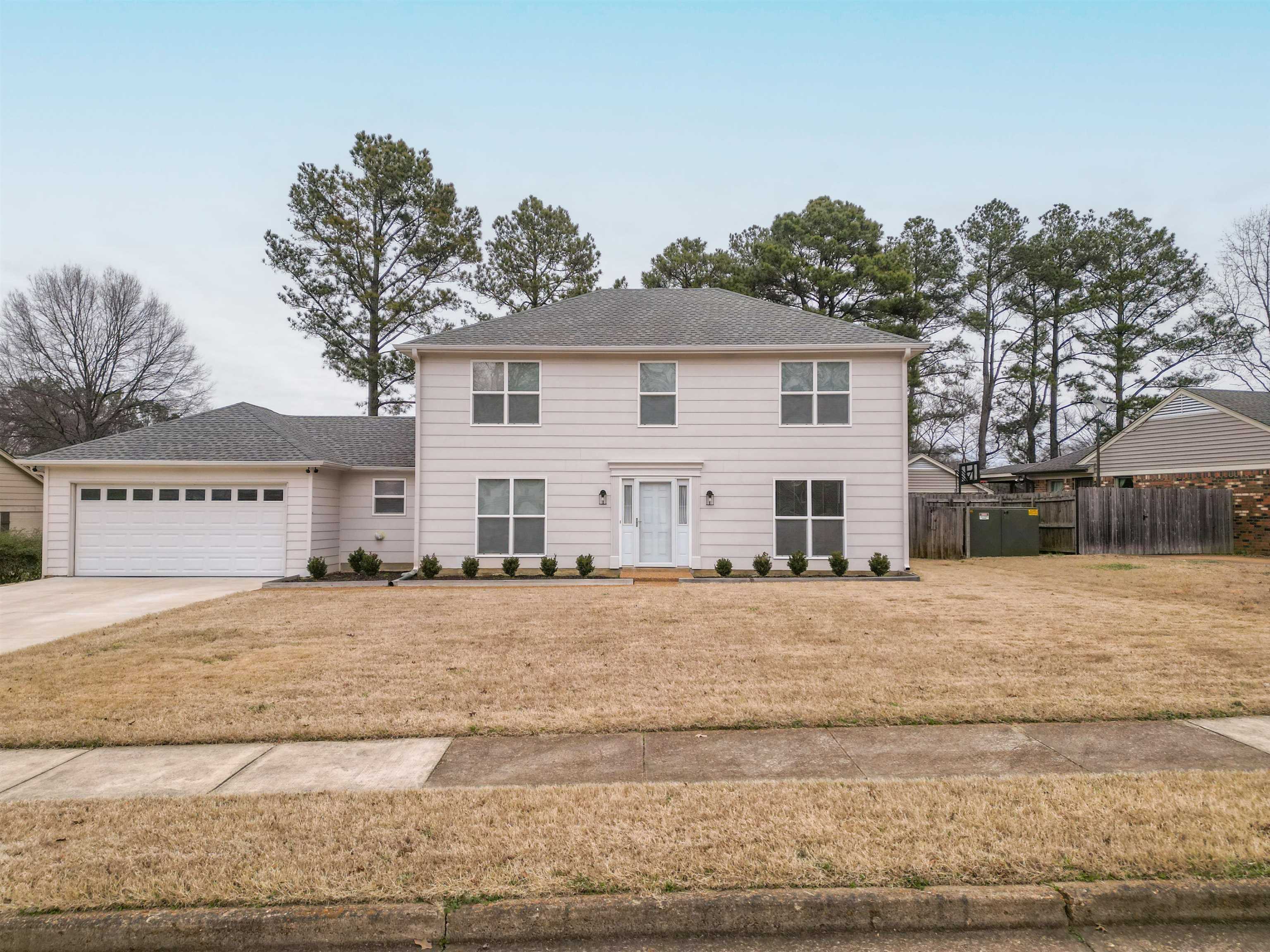 1642 Brierbrook Road Germantown, TN 38138 - Photo 2 of 37 View of front of property featuring a front lawn and a garage