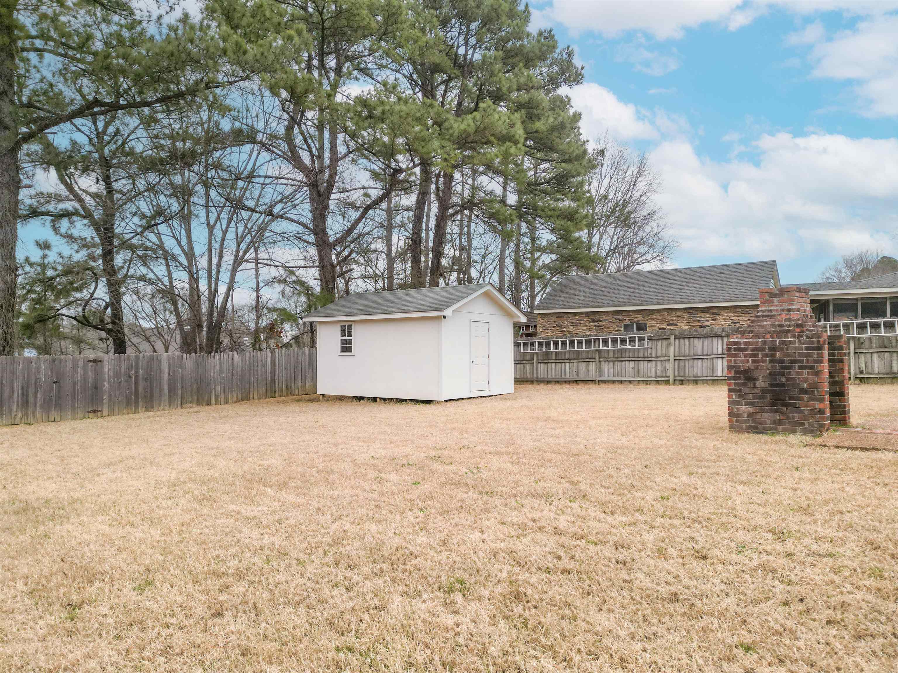 1642 Brierbrook Road Germantown, TN 38138 - Photo 32 of 37 View of yard with a storage unit