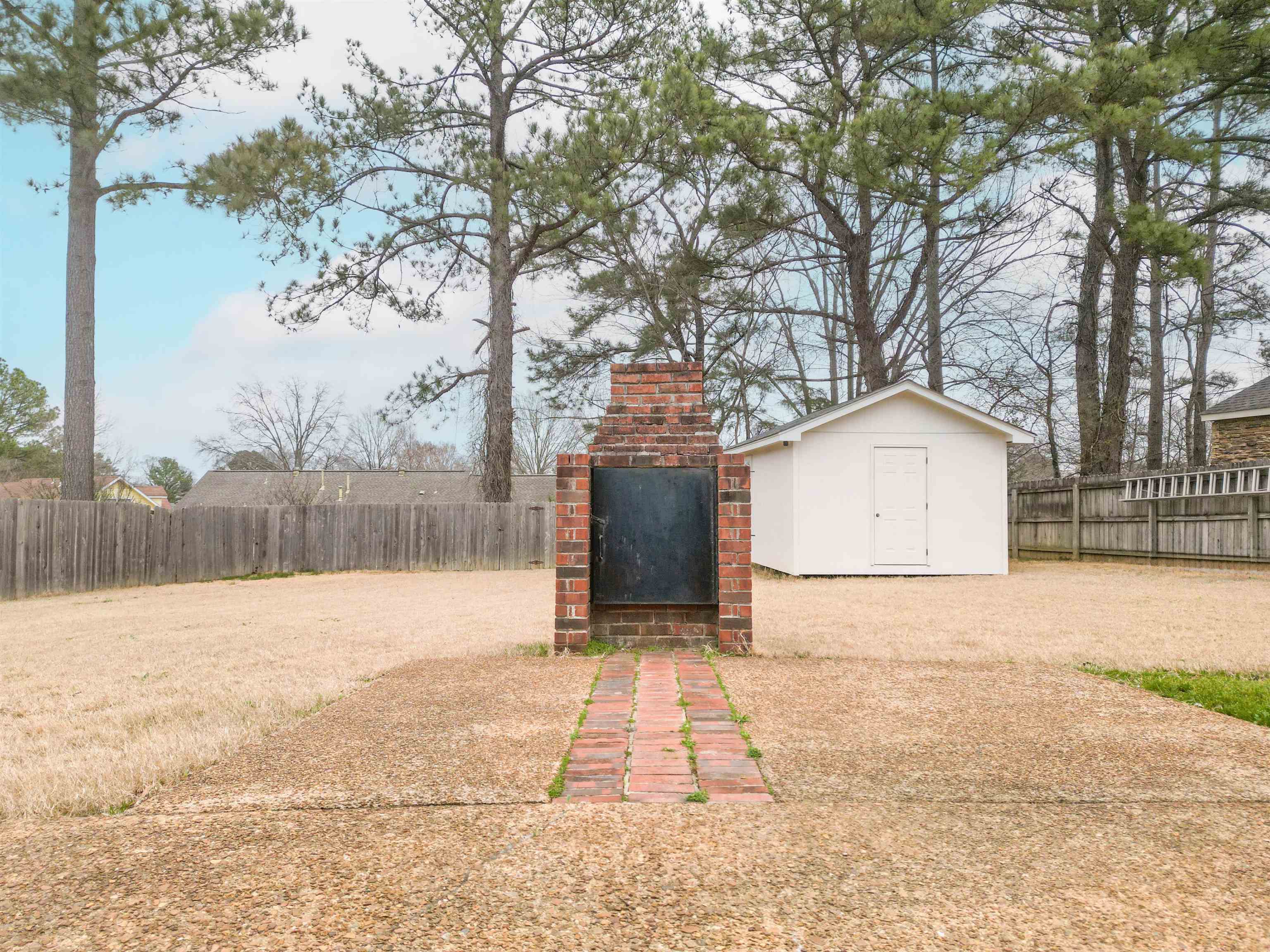 1642 Brierbrook Road Germantown, TN 38138 - Photo 33 of 37 View of yard with a storage shed
