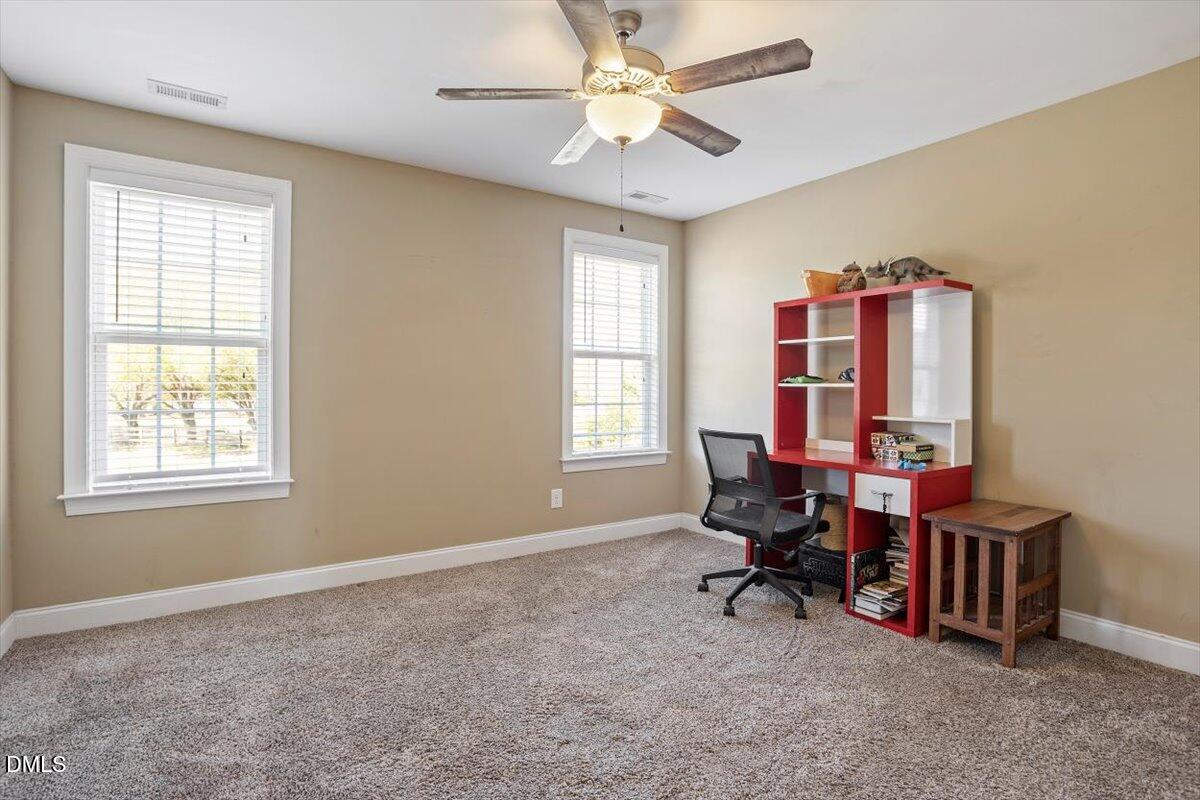 1001 Bellewood Farms Road Raleigh, NC 27603 - Photo 35 of 39 a view of a workspace with furniture and a window