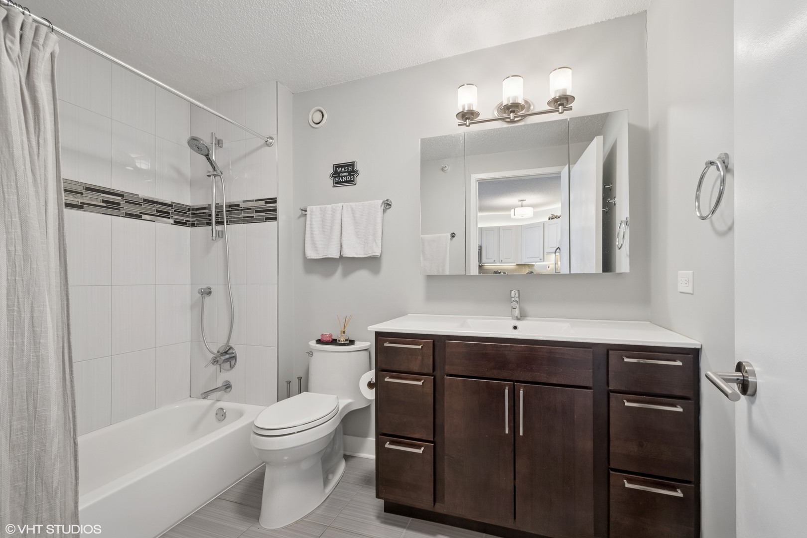 545 North Dearborn Street, Unit 1904 Chicago, IL 60654 - Photo 11 of 35 a bathroom with a sink a toilet and shower