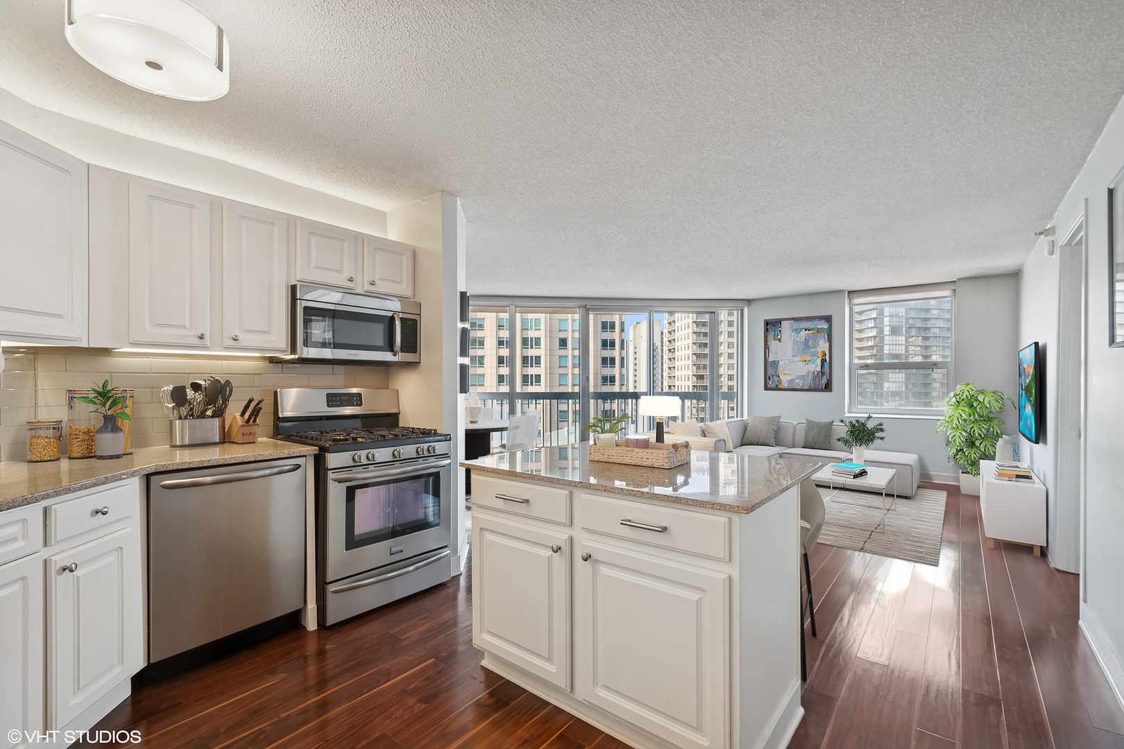 545 North Dearborn Street, Unit 1904 Chicago, IL 60654 - Photo 4 of 35 a kitchen with sink a stove and cabinets