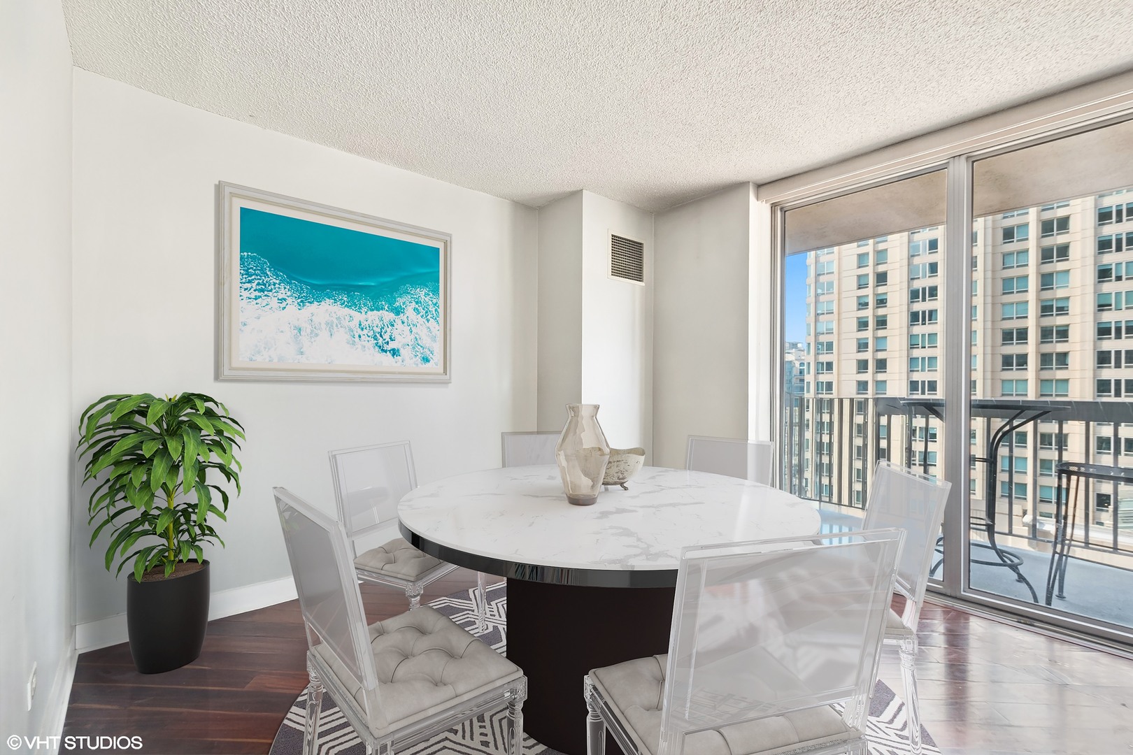 545 North Dearborn Street, Unit 1904 Chicago, IL 60654 - Photo 6 of 35 a view of a dining room with furniture window and wooden floor