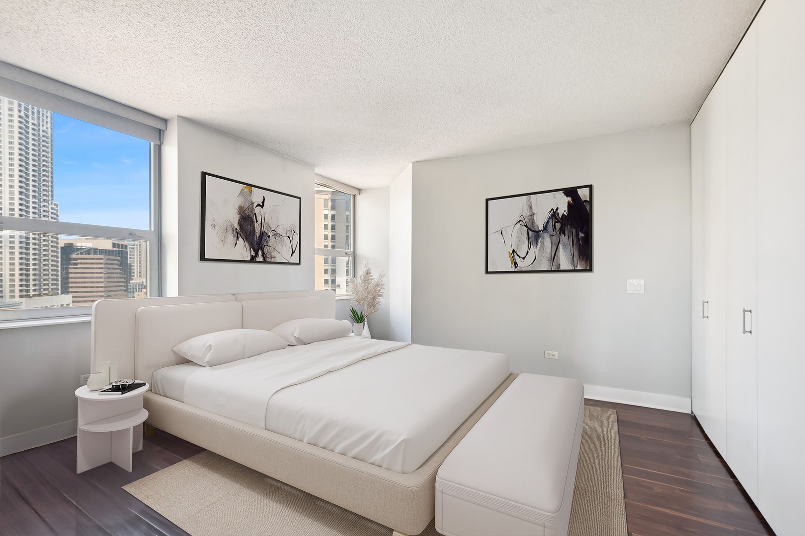 545 North Dearborn Street, Unit 1904 Chicago, IL 60654 - Photo 10 of 35 a bedroom with a bed and a large window
