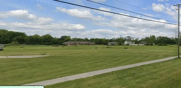 a view of a golf course with a lake