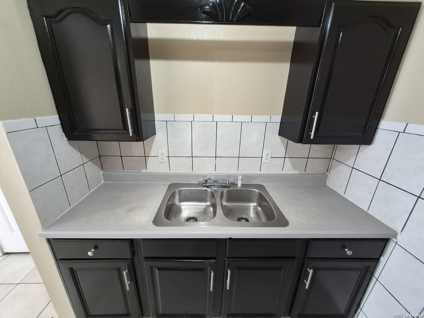 1016 Blanco Road, Unit 104 San Antonio, TX 78212 - Photo 11 of 23 a kitchen with a sink a stove and cabinets