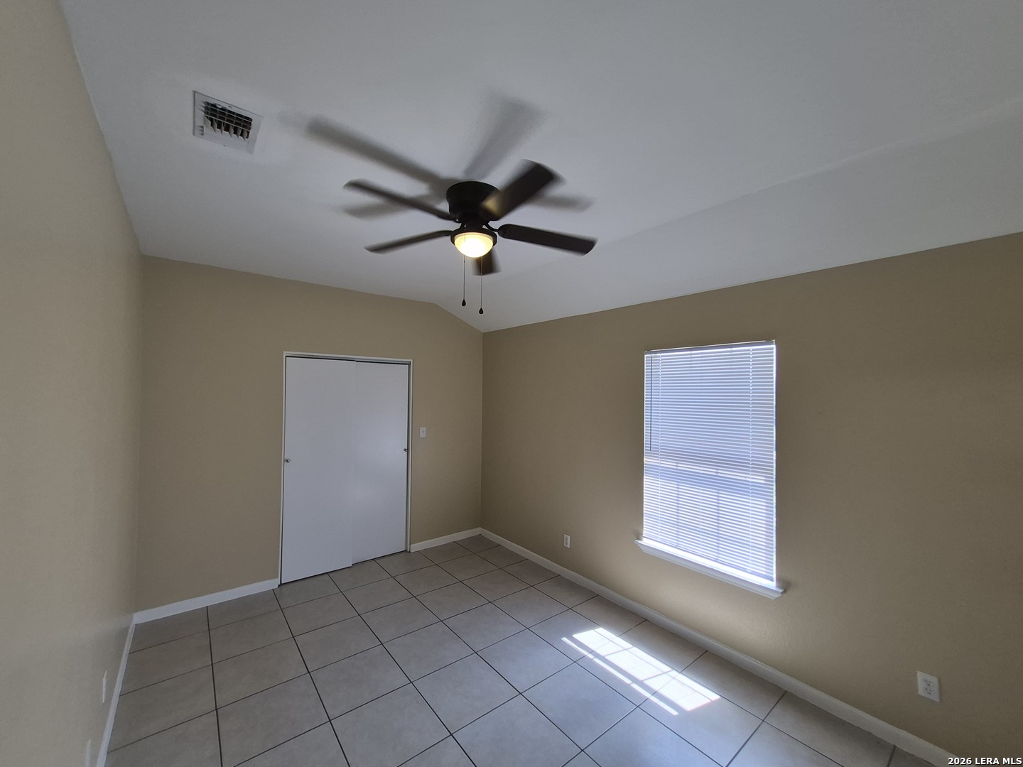 1016 Blanco Road, Unit 104 San Antonio, TX 78212 - Photo 12 of 23 an empty room with windows and fan