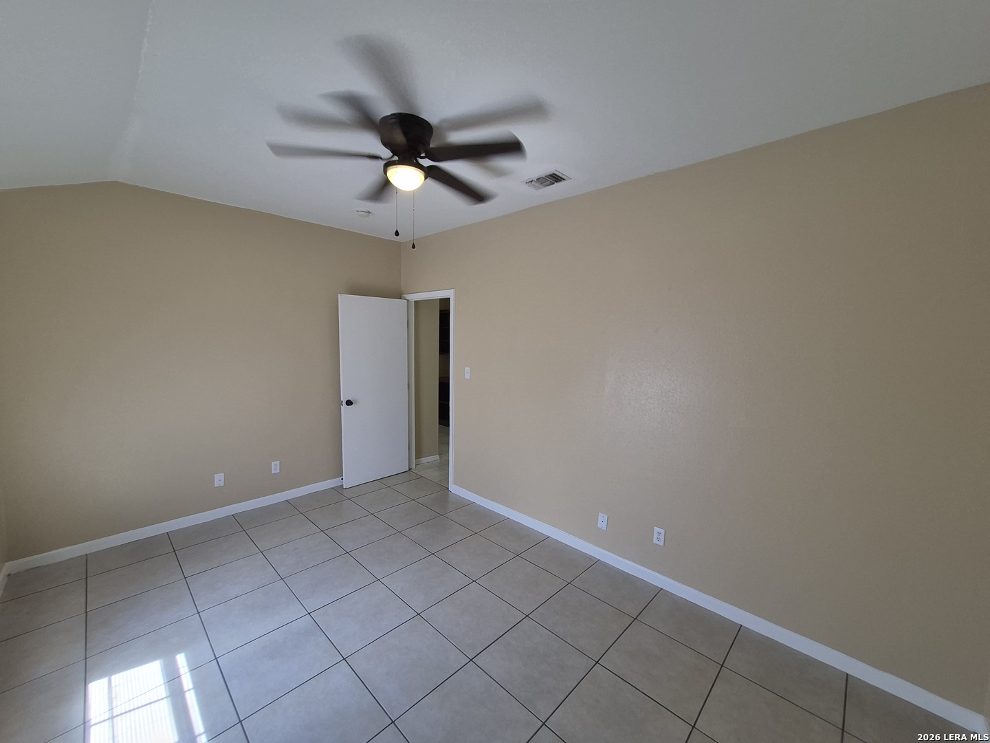 1016 Blanco Road, Unit 104 San Antonio, TX 78212 - Photo 14 of 23 an empty room with a ceiling fan and carpet