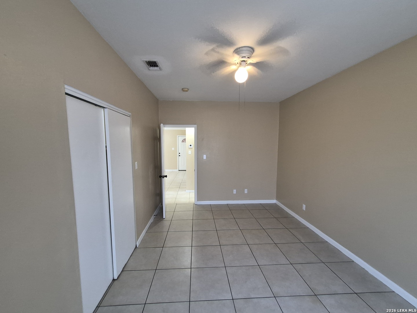 1016 Blanco Road, Unit 104 San Antonio, TX 78212 - Photo 17 of 23 an empty room with closet and a chandelier fan