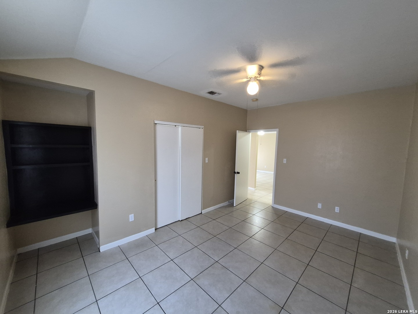 1016 Blanco Road, Unit 104 San Antonio, TX 78212 - Photo 21 of 23 a view of an empty room with a ceiling fan and window