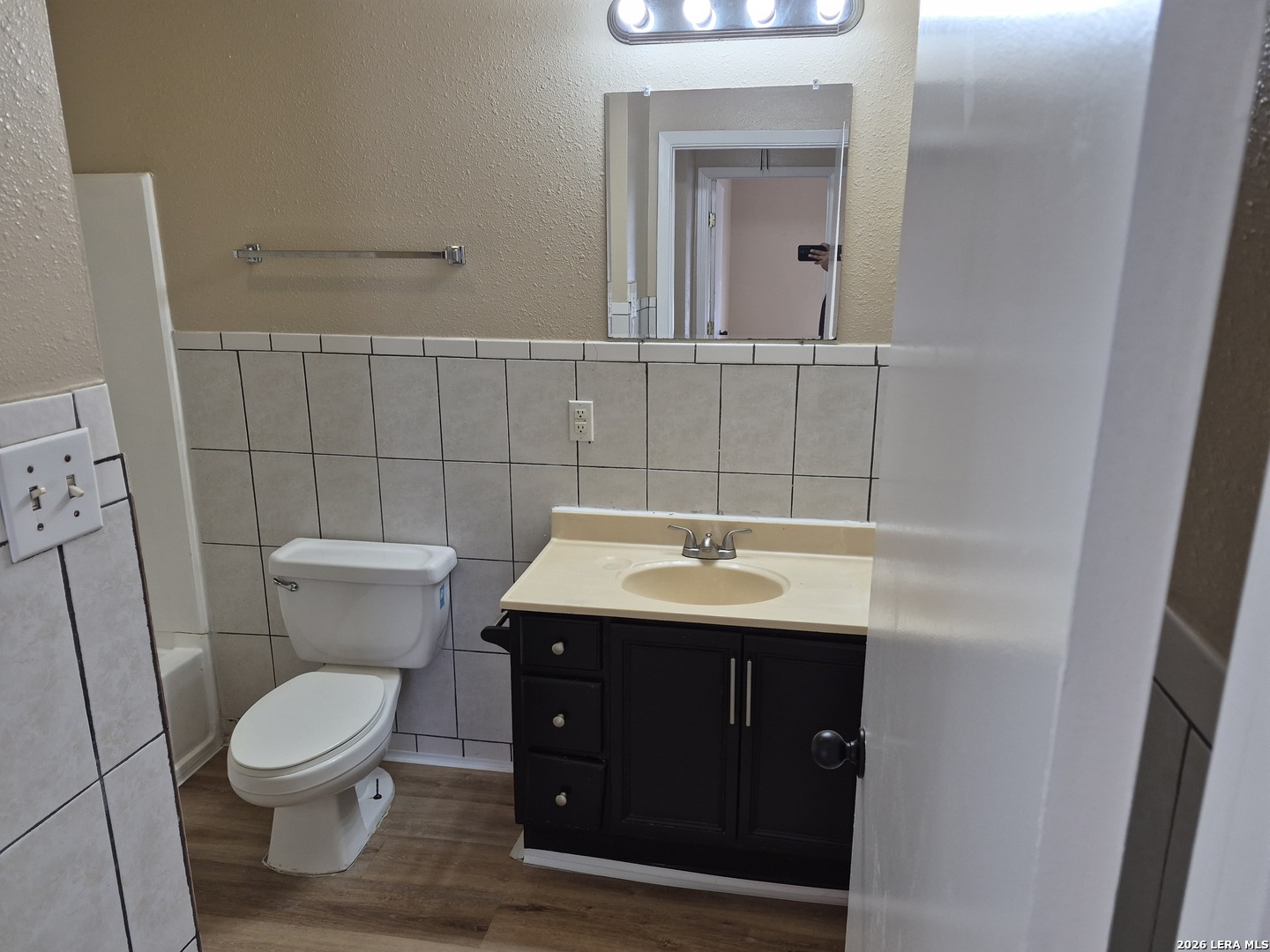 1016 Blanco Road, Unit 104 San Antonio, TX 78212 - Photo 22 of 23 a bathroom with a toilet a sink and mirror