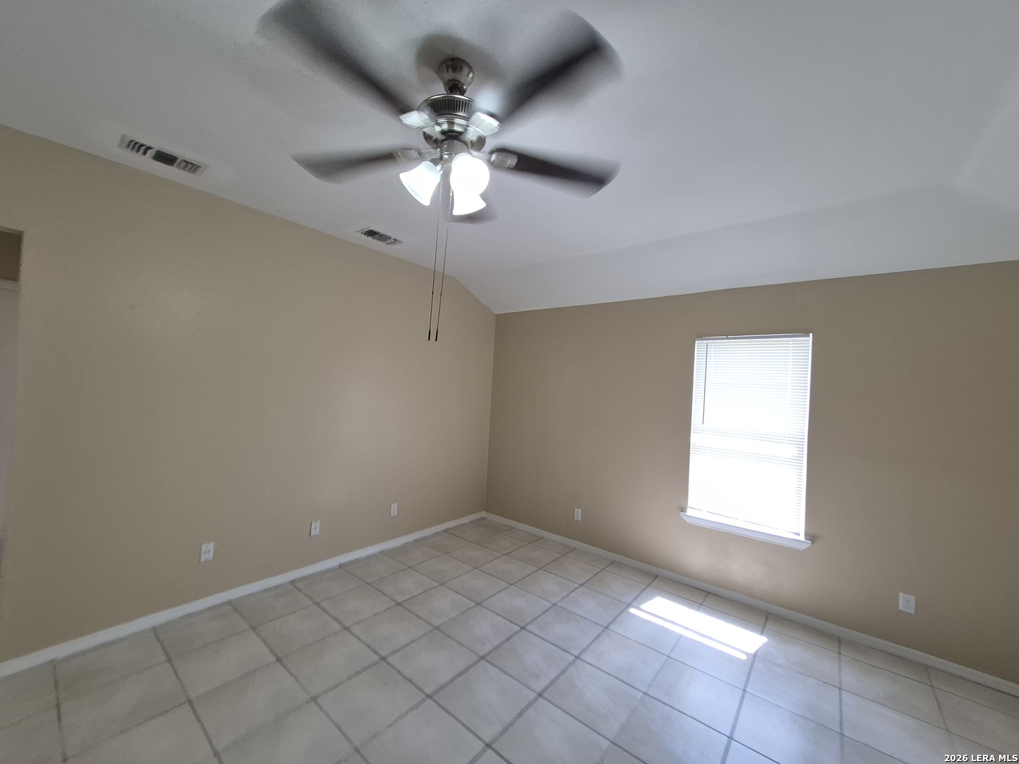 1016 Blanco Road, Unit 104 San Antonio, TX 78212 - Photo 3 of 23 en empty room with windows and chandelier fan