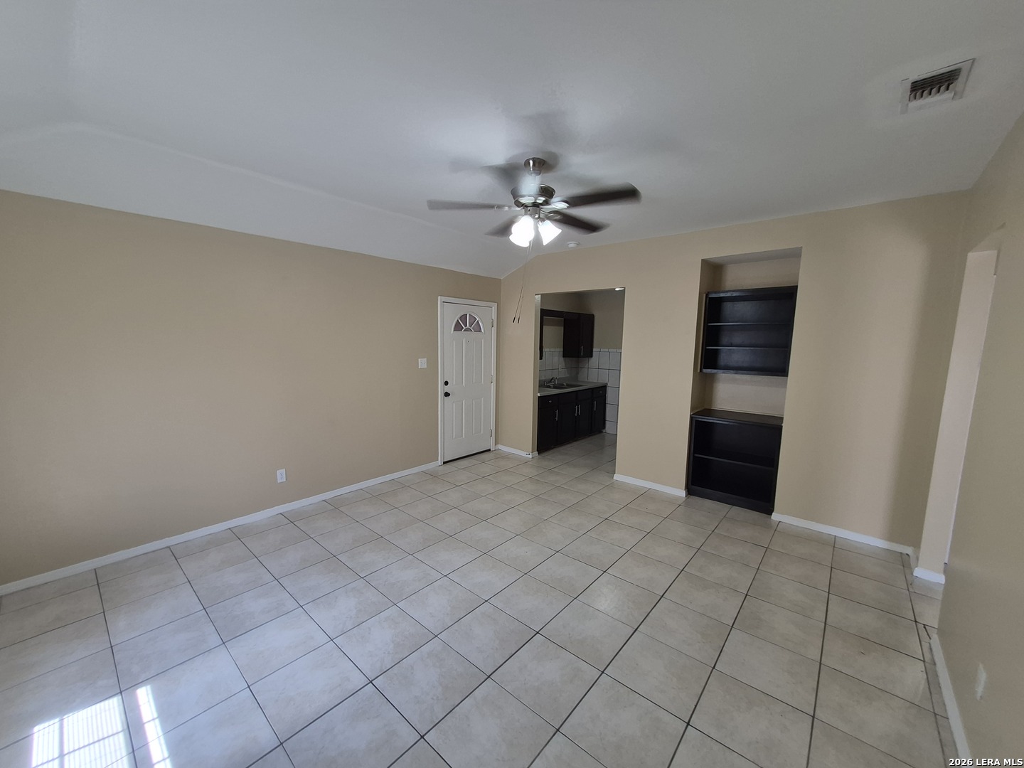 1016 Blanco Road, Unit 104 San Antonio, TX 78212 - Photo 6 of 23 a view of an empty room with a ceiling fan