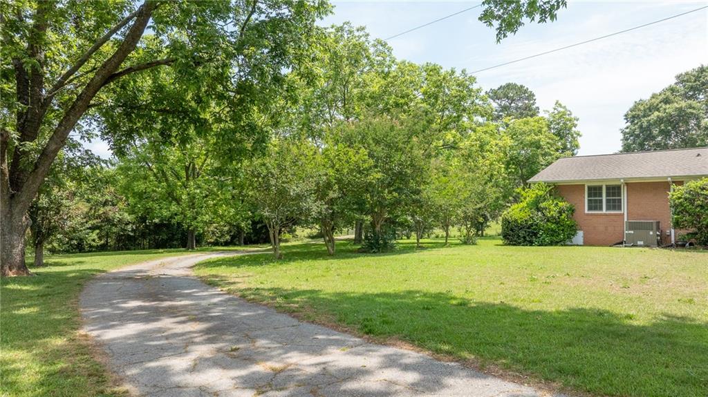 570 Wildcat Bridge Road Royston, GA 30662 - Photo 26 of 29 a view of a house with a big yard