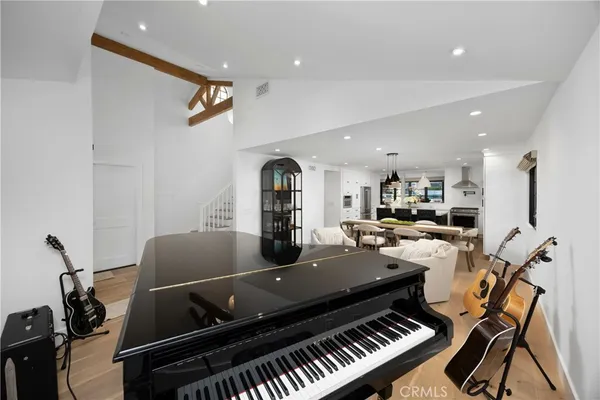 a kitchen with stainless steel appliances a sink stove and window