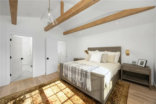 a view of a patio with table and chairs potted plants with wooden floor and fence