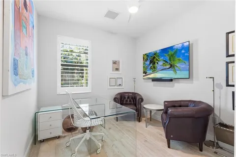 a workspace with furniture and a window