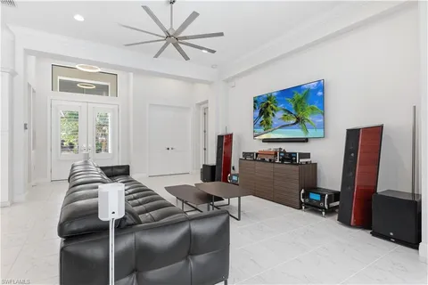 a bedroom with furniture and a flat screen tv