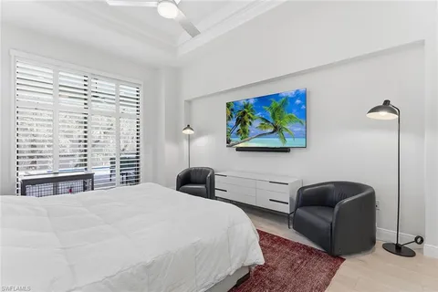 a bedroom with a bed and a couch