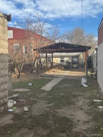 a view of a building with a yard